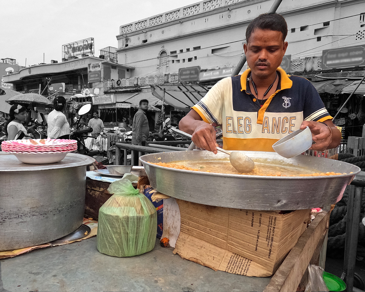 A person scooping a food!